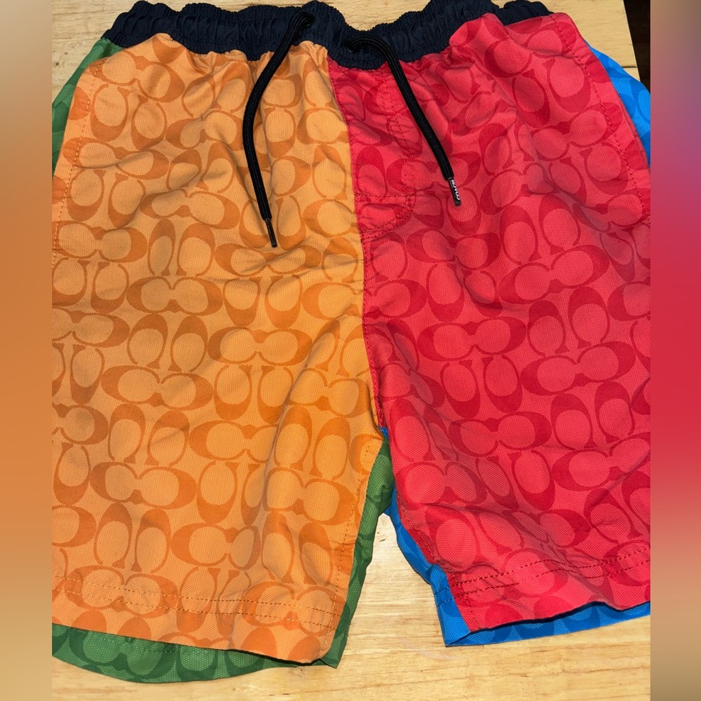 Multicolored swimming trunks coach brand fit comfortably